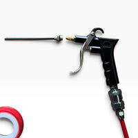 Close-up of the blow gun with its long nozzle extension and quick-connect fitting