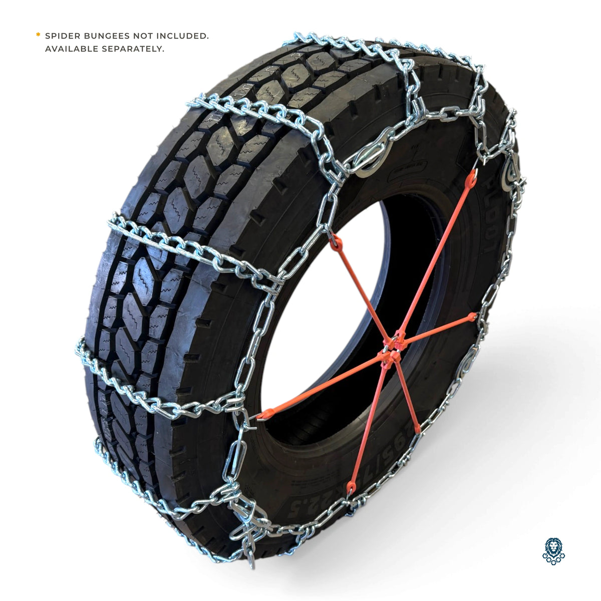 Tire at an angle with the chain fitted and an orange spider bungee, noted as not included