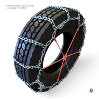Tire at an angle with the chain fitted and an orange spider bungee, noted as not included