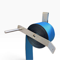 Angled view of the clip-on winch strap winder with a wound blue strap on the roller and the handle rod extended