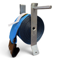 Clip-on winch strap winder holding a fully wound blue winch strap, its flat hook hanging below the coil