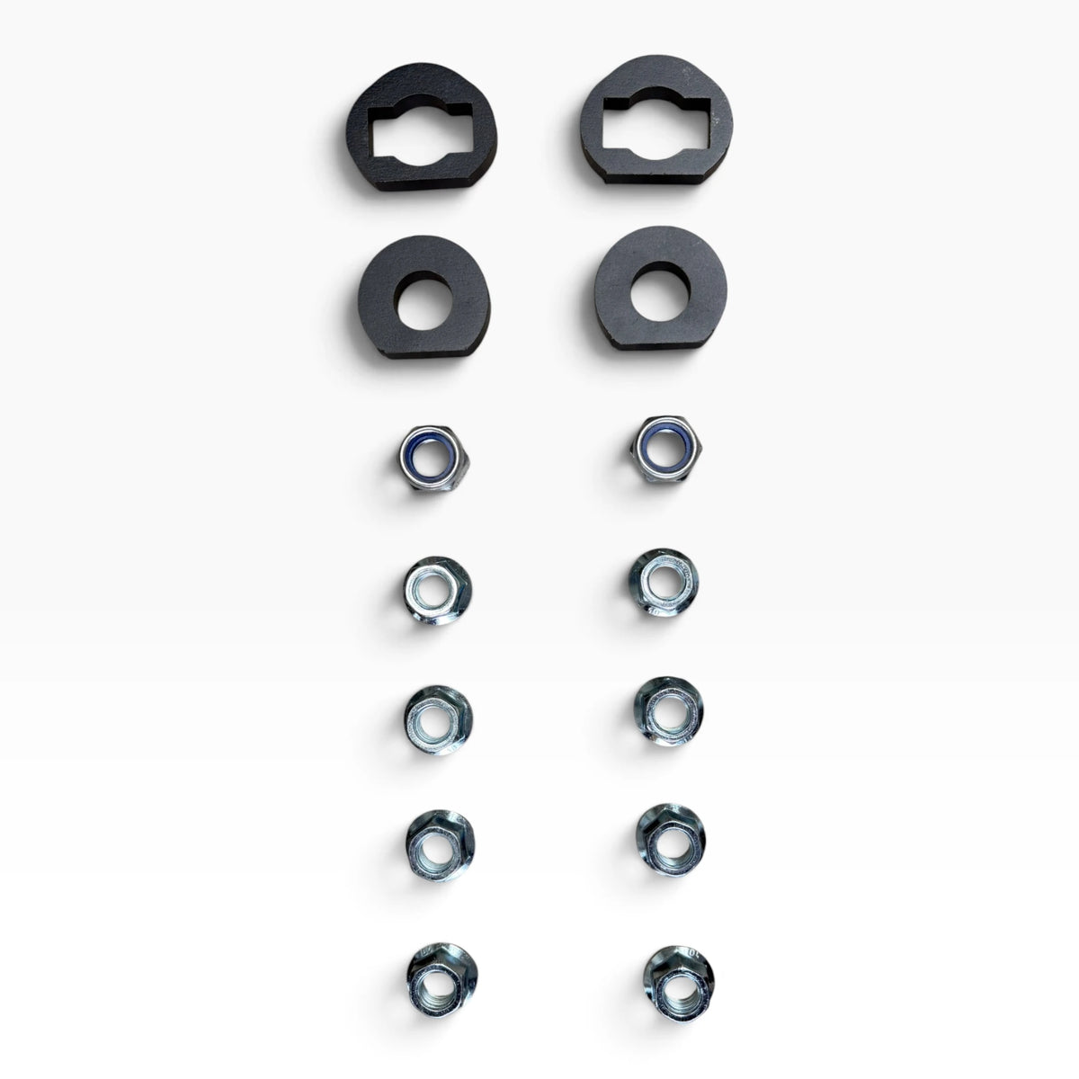 Hardware of the Cascadia deer guard bracket set: two keyed plates, two round washers, two lock nuts and eight flange nuts