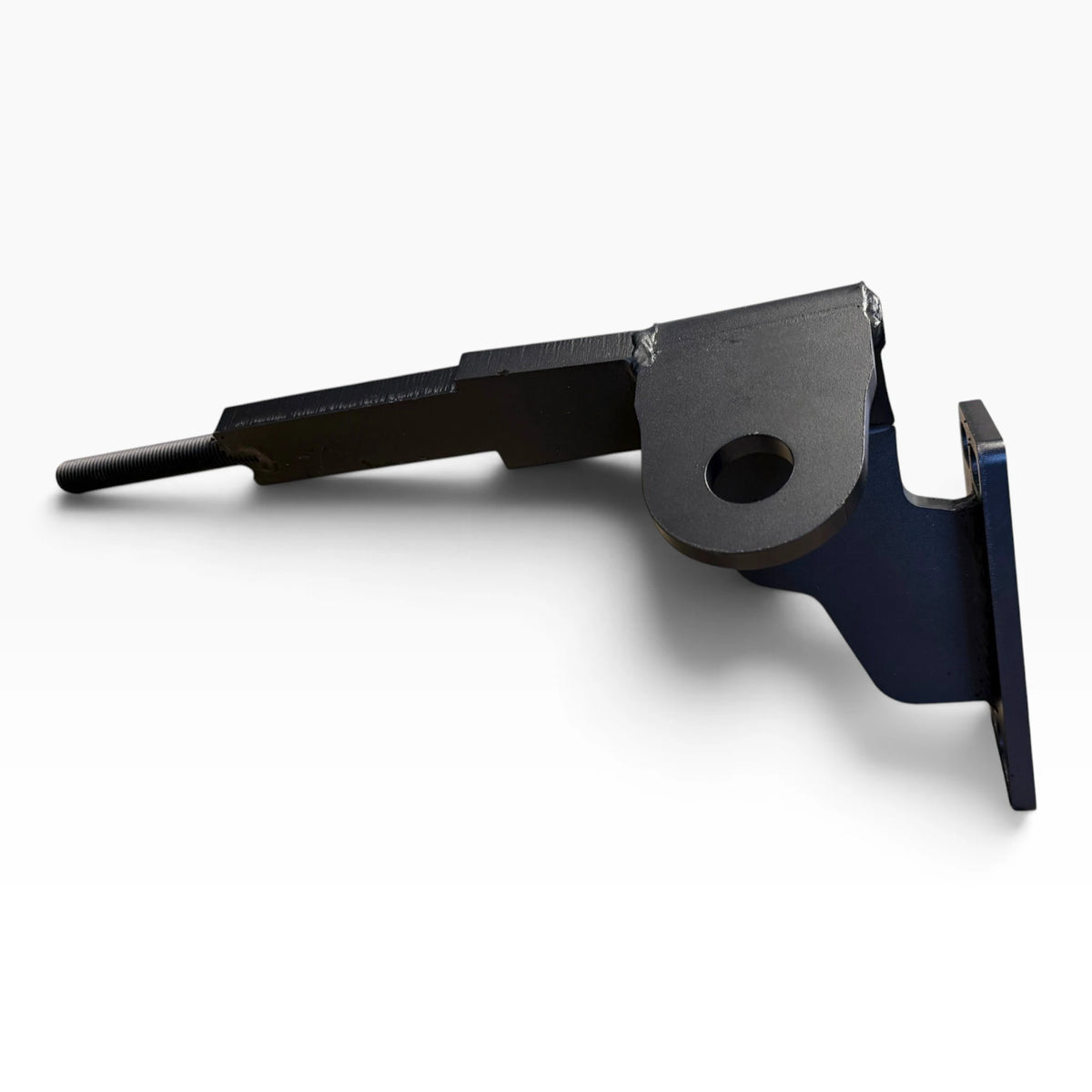One Cascadia 2026+ deer guard bracket from the side: the arm with its threaded end, a towing eye and the mounting plate