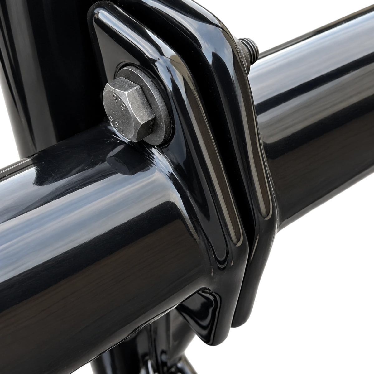 Close-up of the bolted clamp that holds a side wing to the deer guard's center frame