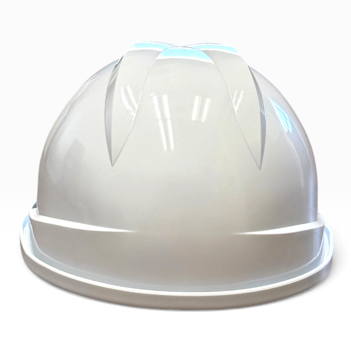 White hard hat seen from the back, showing the two raised ribs on the crown and the narrow rim at the base.