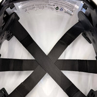 Three black suspension straps crossing inside the hard hat crown, with part of a printed label at the top edge.