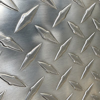 Close-up of the door's diamond plate surface