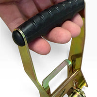 A hand gripping the black rubber ratchet handle, showing the size of the lever.