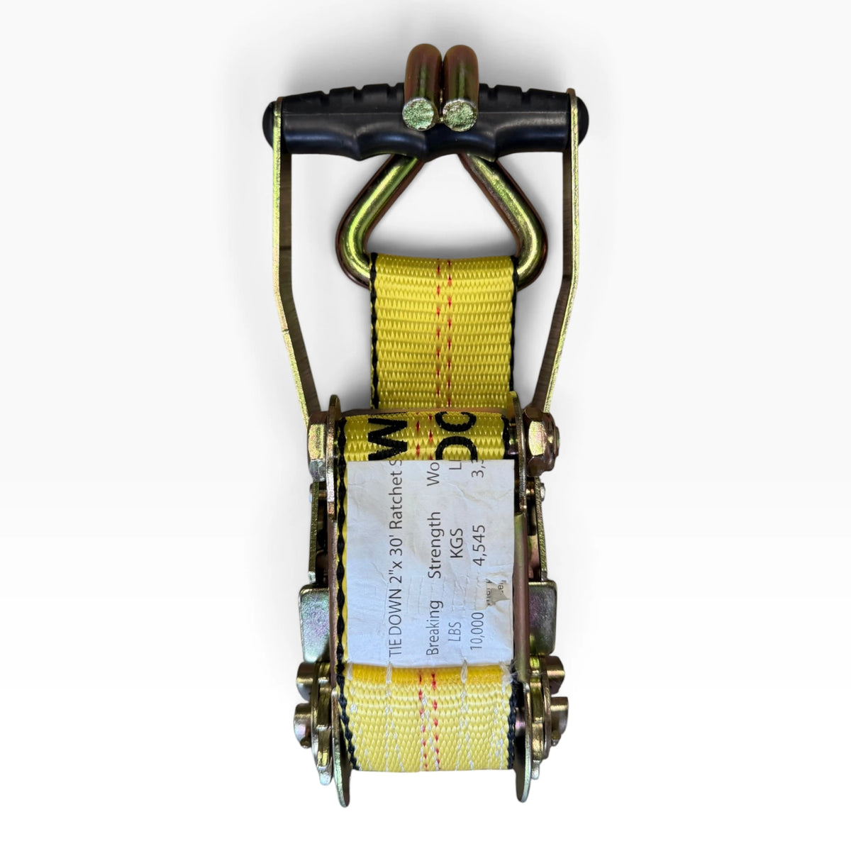 Top view of the closed ratchet with webbing threaded through the spool and the spec label visible.