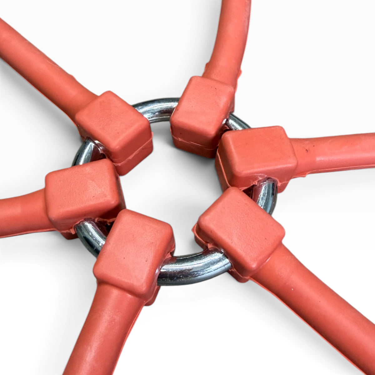 Close-up of the steel center ring and rubber arm ends of a spider bungee