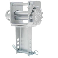 Zinc-plated stake pocket winch viewed from the gear side, showing the ratchet teeth and spool