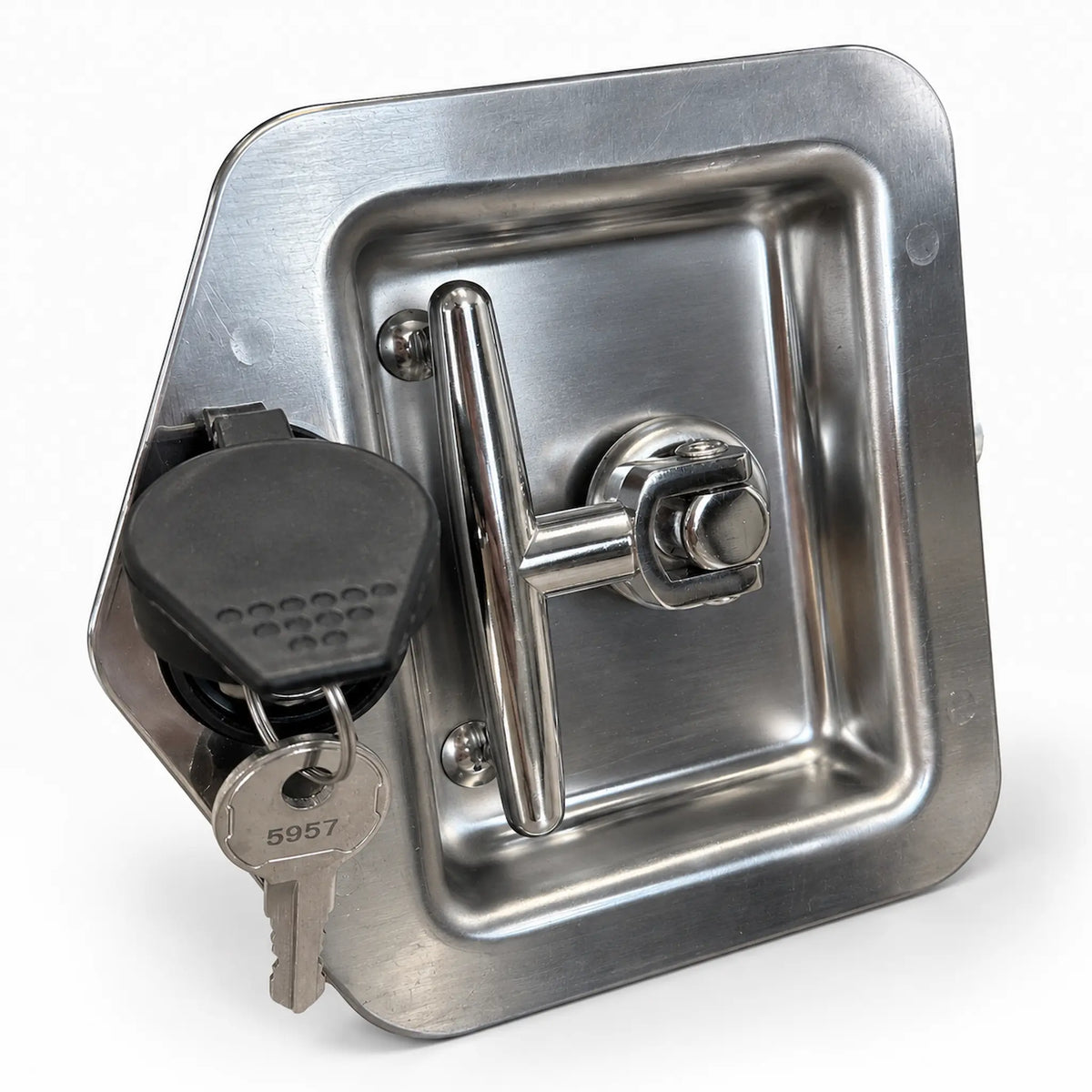 T-handle lock at an angle with the rubber cap swung open and the keys in the cylinder