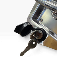 Close-up of the key cylinder with a key in it and the rubber cap swung open