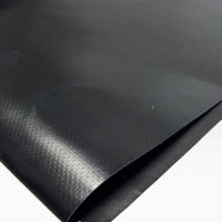 Close-up of the black vinyl patch surface with one edge folded over