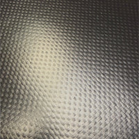 Macro view of the patch's coated surface showing the fabric weave pattern