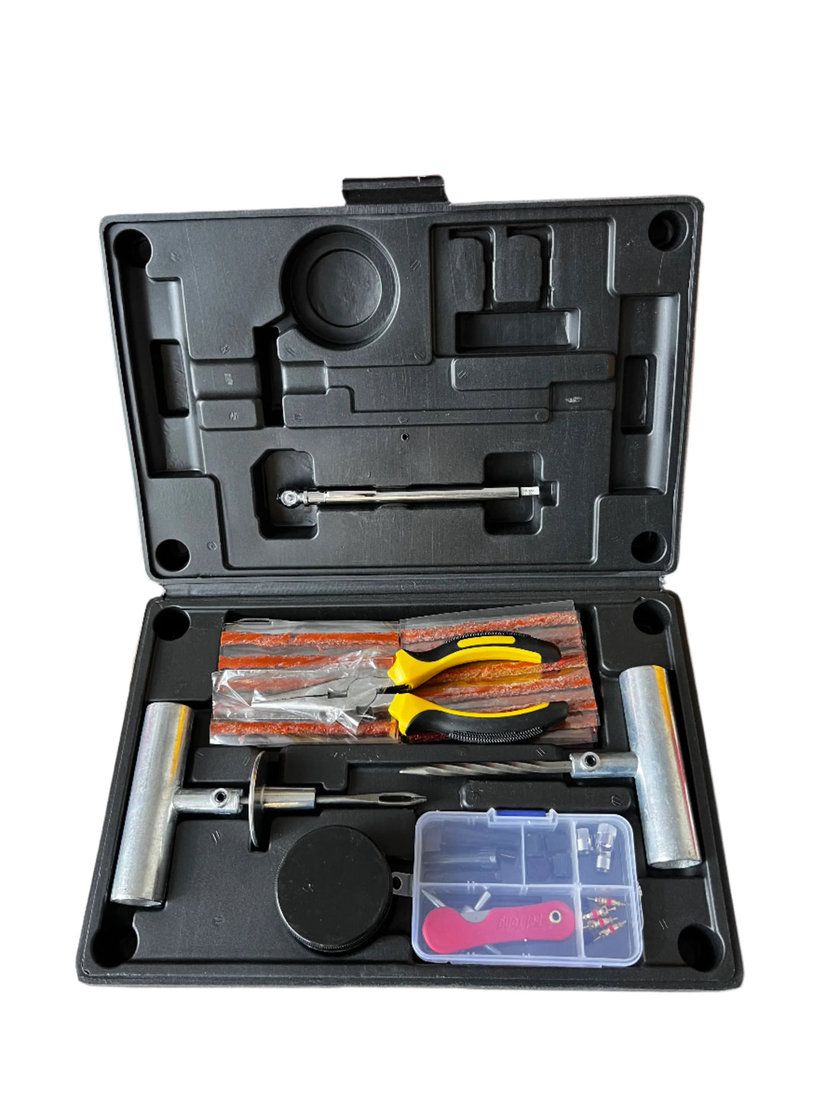 Tire repair kit case open, showing plug strips, pliers, insertion tools, and a parts tray