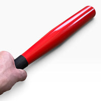 Hand holding the tire thumper by its black anti-slip grip