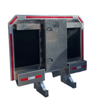 Closed tool box door centered between two open mesh compartments on a headache rack assembly