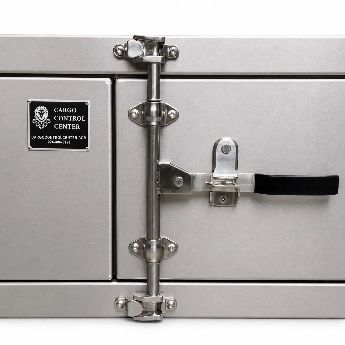 Close-up of the center latch bar and black handle on the tool box, next to the Cargo Control Center nameplate.