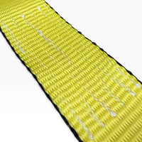 White zigzag stitching running along the yellow webbing between its black woven edges