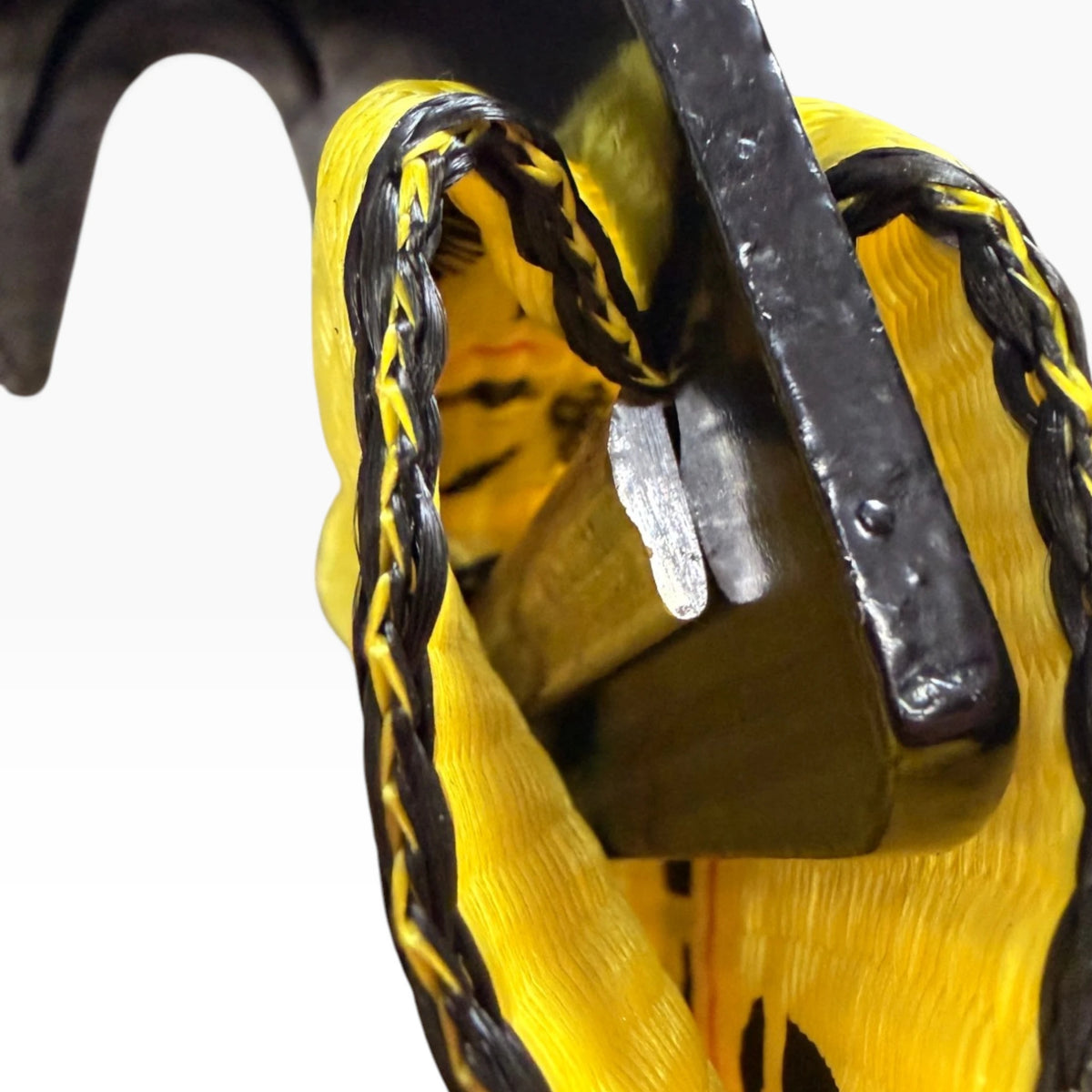 Macro of the black stitching holding the webbing wrapped around the flat hook bar.