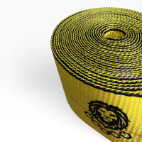 Close-up of the tightly wound coil showing black edge stitching and the printed lion logo