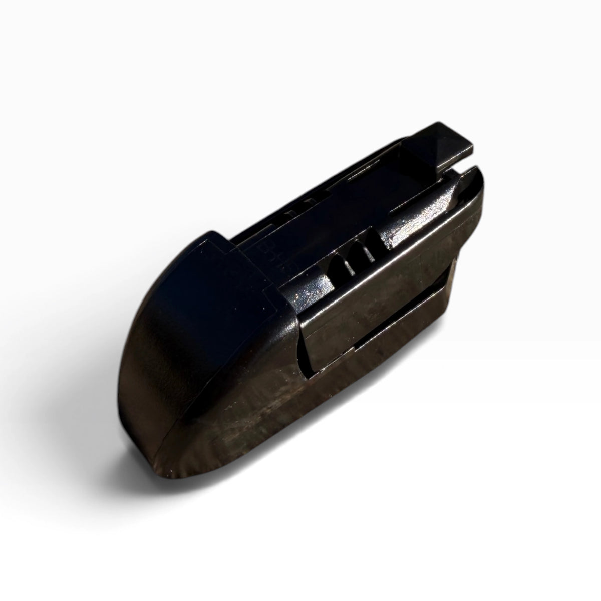 Close-up of the wiper blade's black plastic adapter clip shown by itself