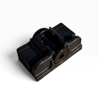 Close-up of the wiper blade's adapter base showing its center pivot hole and side grooves
